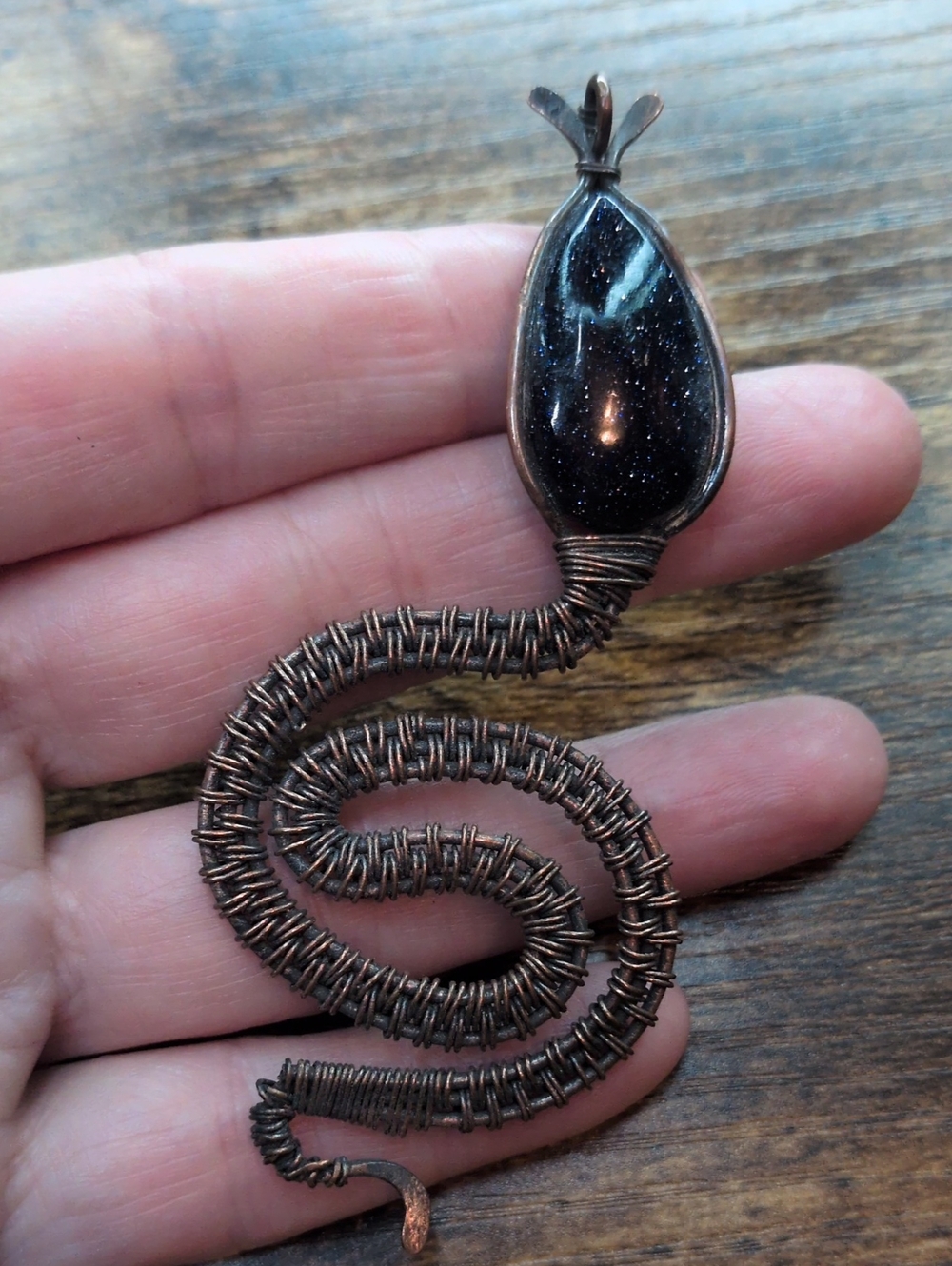 Handcrafted Copper Wire Wrapped Black Goldstone Snake Pendant
